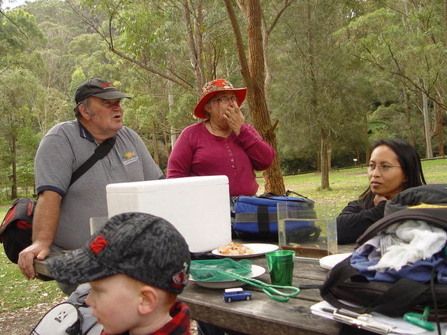 ANGFA members gathered outdoors around a picnic table
