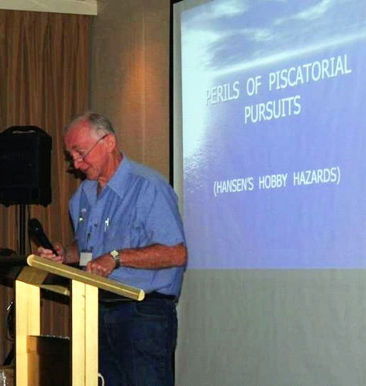 Bruce Hansen presenting Hansen's Hobby Hazards at the podium