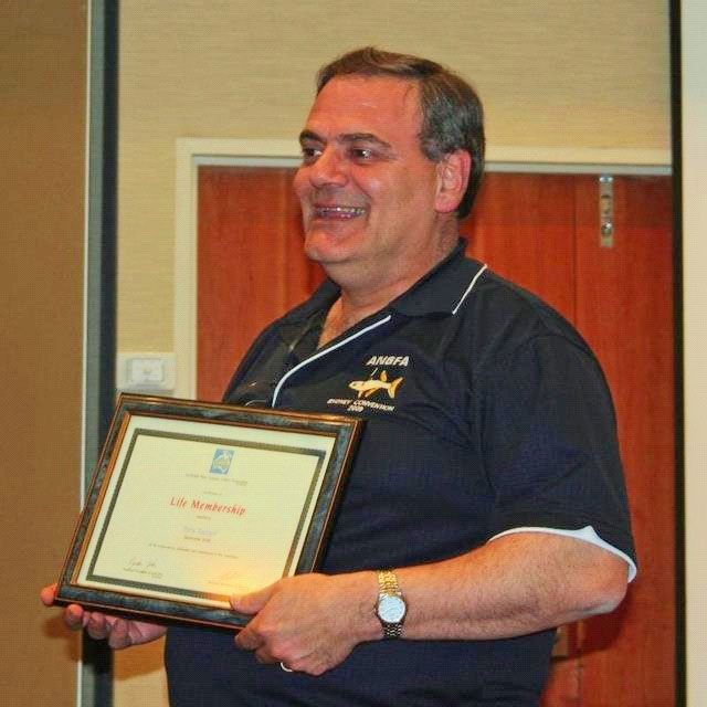 Tony Tucceri holding his ANGFA Life Membership certificate