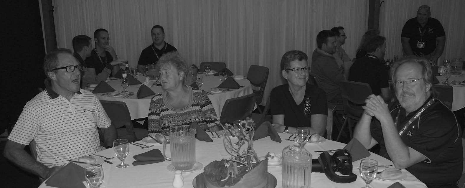Delegates seated together at a convention dinner table