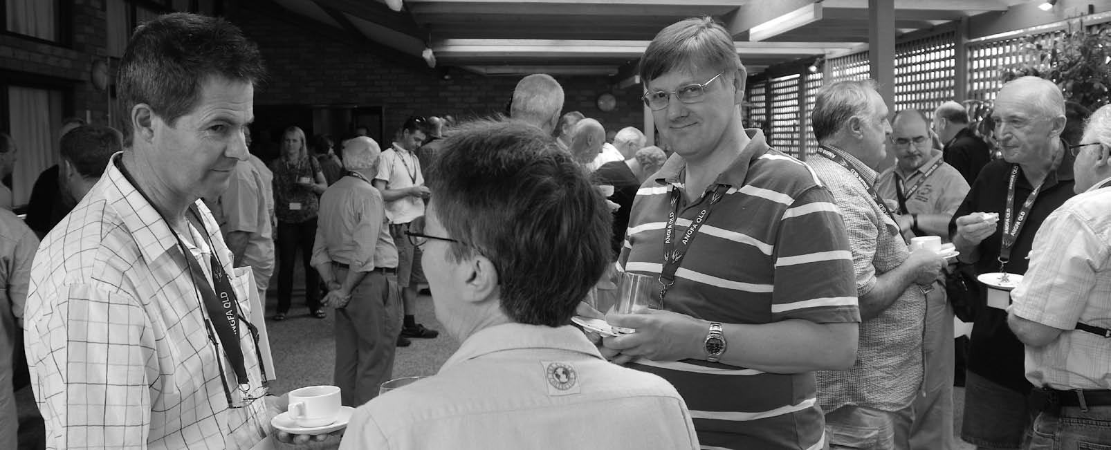 Delegates chatting over coffee between sessions