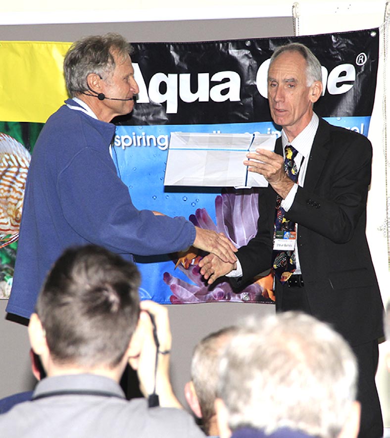 Steve Baines at the podium during the auction